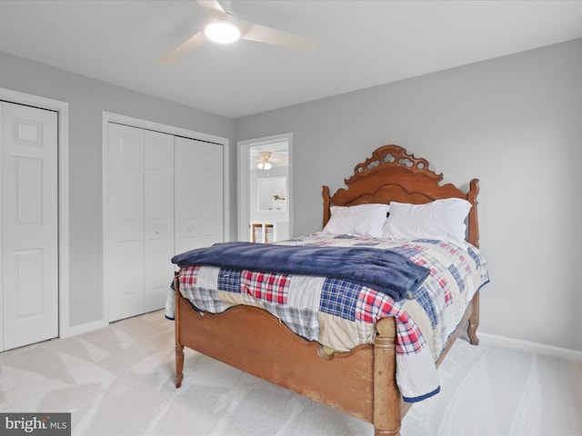carpeted bedroom featuring baseboards, a ceiling fan, and a closet