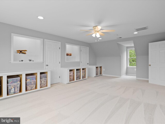 unfurnished living room with carpet floors, a ceiling fan, recessed lighting, baseboards, and vaulted ceiling
