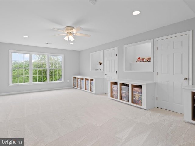 game room with a ceiling fan, light colored carpet, and recessed lighting