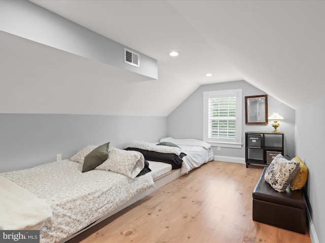 bedroom featuring wood-type flooring, lofted ceiling, recessed lighting, and baseboards