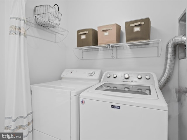 washroom with washer and clothes dryer