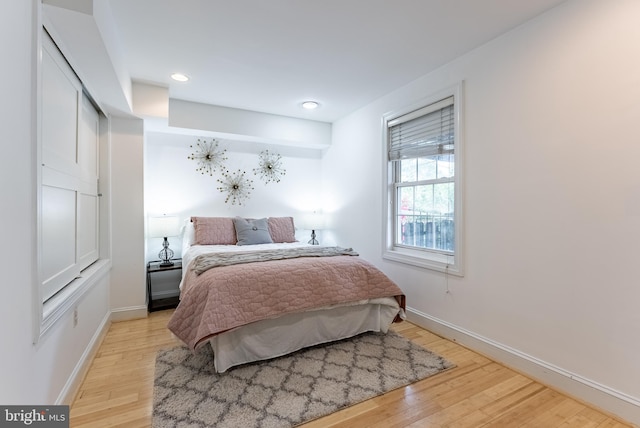 1840 D St NE Unit 1, Washington, DC 20002 - bedroom with light wood-type flooring, baseboards, and recessed lighting