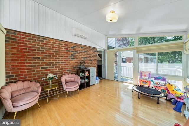 sunroom / solarium featuring a wall mounted air conditioner