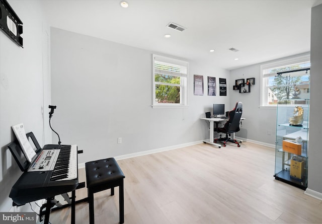 office space with wood finished floors, baseboards, and recessed lighting