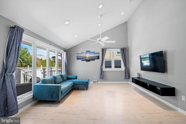 living area featuring light wood-style flooring, recessed lighting, ceiling fan, baseboards, and high vaulted ceiling