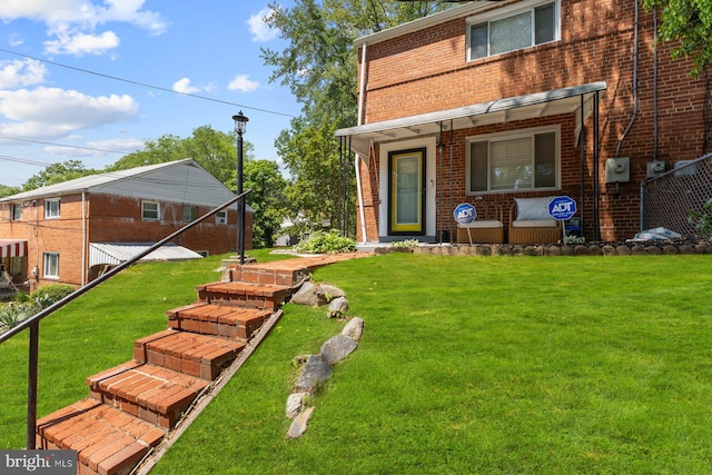 view of grassy yard with covered porch