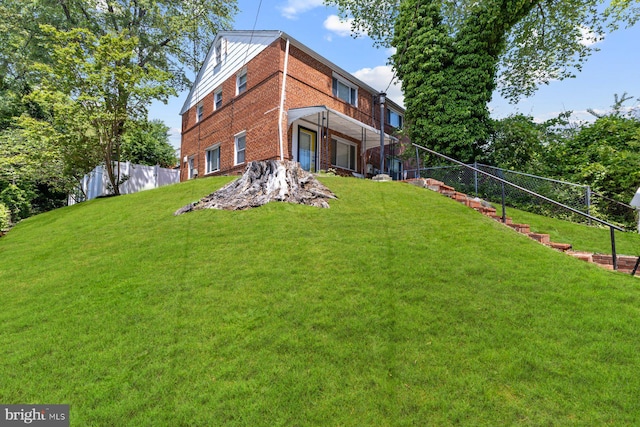 rear view of house with brick siding