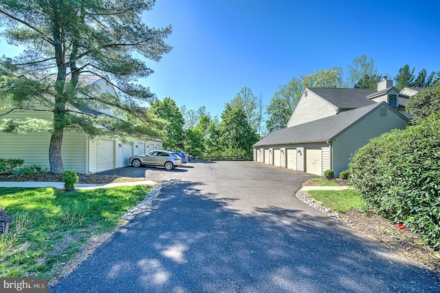 4 Ingham Way, New Hope, PA 18938 - view of asphalt driveway featuring community garages