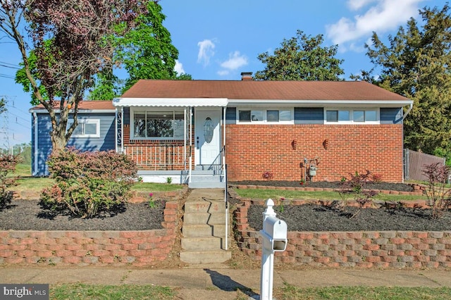 view of front of property featuring brick siding