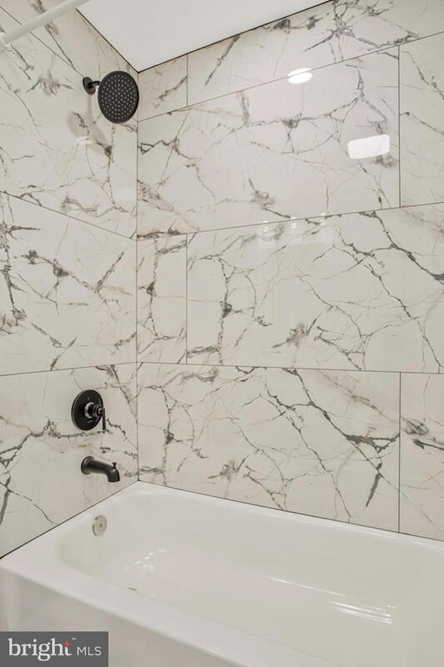 full bath featuring washtub / shower combination