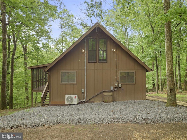 106 Monacan Trl, Hedgesville, WV 25427 - view of home's exterior featuring a cooling unit, stairs, and a sunroom