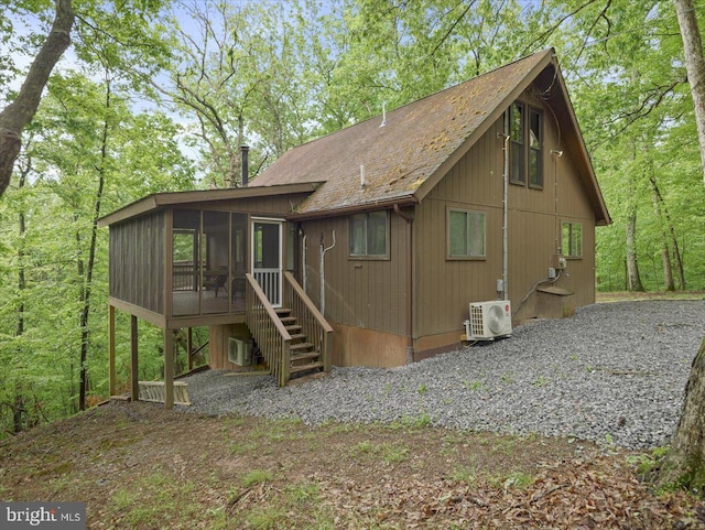 106 Monacan Trl, Hedgesville, WV 25427 - rear view of house featuring a sunroom, a cooling unit, stairway, and a shingled roof