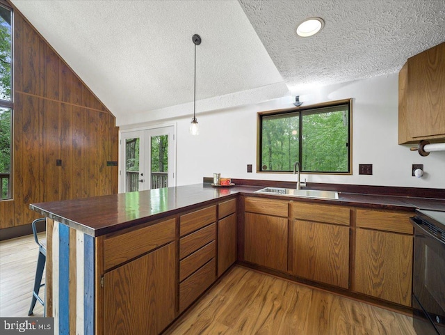 106 Monacan Trl, Hedgesville, WV 25427 - kitchen featuring a sink, dark countertops, a textured ceiling, vaulted ceiling, and range