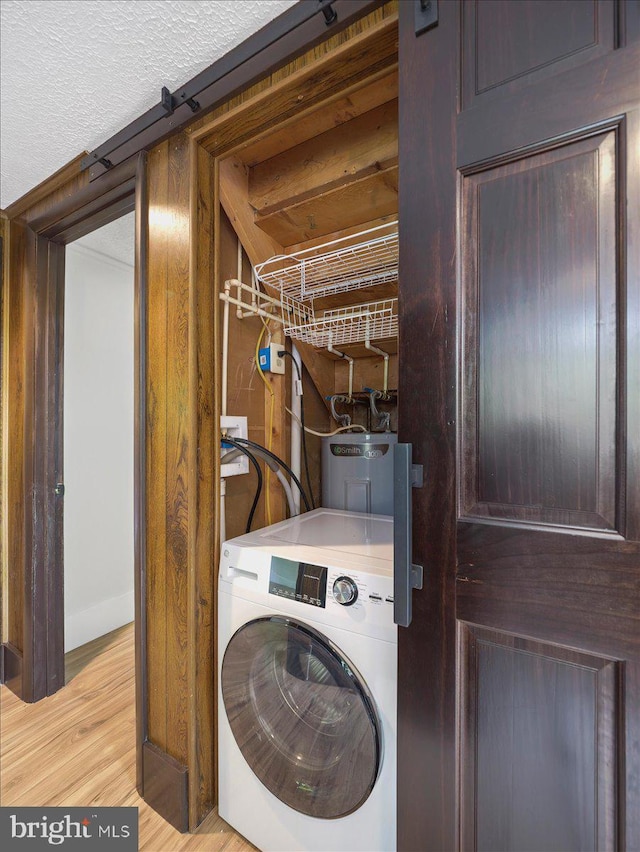106 Monacan Trl, Hedgesville, WV 25427 - laundry room with washer / dryer, electric water heater, and wood finished floors