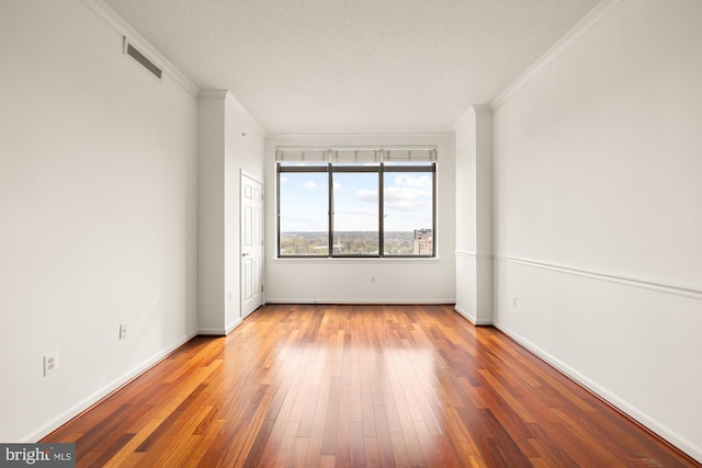 11710 Old Georgetown Rd Unit 1504, North Bethesda, MD 20852 - empty room with ornamental molding, wood finished floors, and baseboards