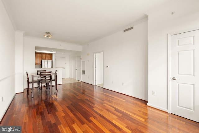 11710 Old Georgetown Rd Unit 1504, North Bethesda, MD 20852 - dining room with wood finished floors, crown molding, and baseboards