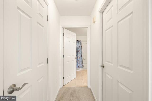 11710 Old Georgetown Rd Unit 1504, North Bethesda, MD 20852 - corridor with light tile patterned floors, light colored carpet, and baseboards
