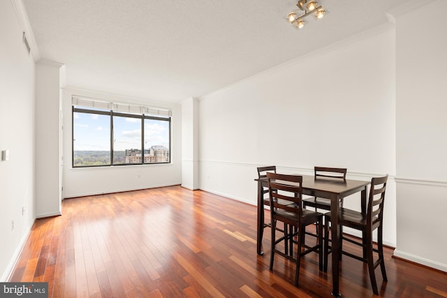 11710 Old Georgetown Rd Unit 1504, North Bethesda, MD 20852 - dining area with crown molding, wood finished floors, and baseboards