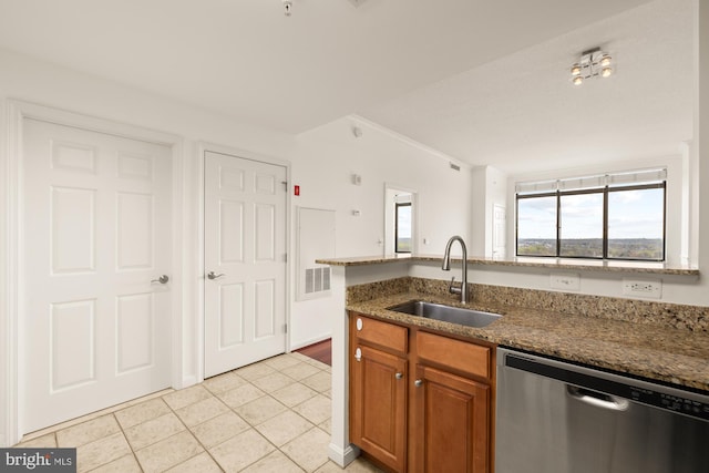11710 Old Georgetown Rd Unit 1504, North Bethesda, MD 20852 - kitchen with dishwasher, a sink, brown cabinetry, light tile patterned floors, and dark stone countertops