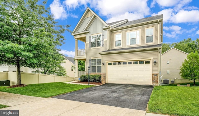 14762 Bell Tower Rd, Woodbridge, VA 22193 - craftsman-style home featuring board and batten siding, asphalt driveway, a garage, a balcony, and central AC unit