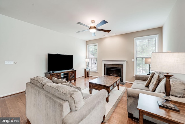 14762 Bell Tower Rd, Woodbridge, VA 22193 - living room featuring a ceiling fan, a glass covered fireplace, wood finished floors, baseboards, and recessed lighting