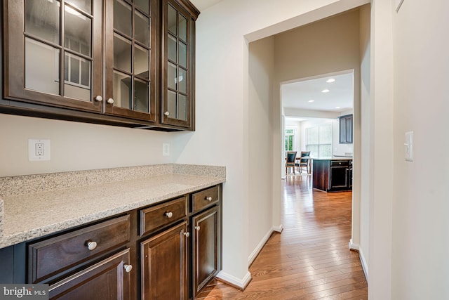 14762 Bell Tower Rd, Woodbridge, VA 22193 - bar with light wood-type flooring, baseboards, and recessed lighting