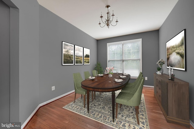 14762 Bell Tower Rd, Woodbridge, VA 22193 - dining space featuring a chandelier, wood finished floors, and baseboards