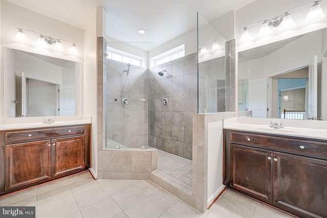14762 Bell Tower Rd, Woodbridge, VA 22193 - bathroom featuring tile patterned flooring, a walk in shower, and two vanities