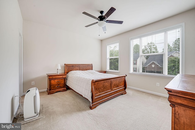 14762 Bell Tower Rd, Woodbridge, VA 22193 - bedroom with baseboards, light colored carpet, and a ceiling fan