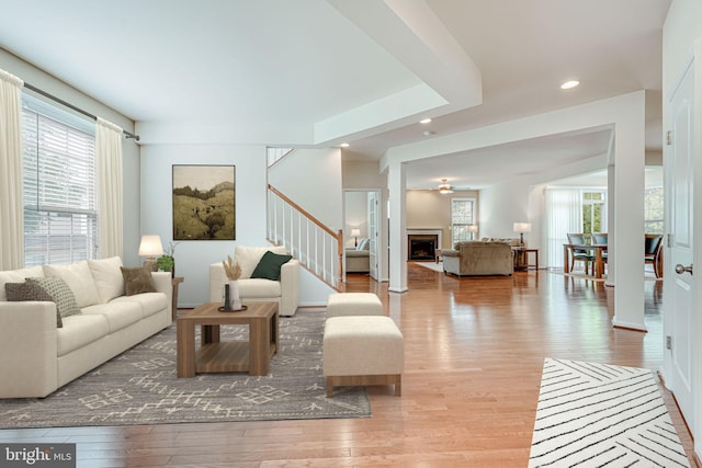 14762 Bell Tower Rd, Woodbridge, VA 22193 - living room featuring healthy amount of natural light, wood finished floors, stairs, a fireplace, and recessed lighting