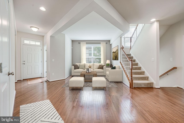 14762 Bell Tower Rd, Woodbridge, VA 22193 - living area featuring wood-type flooring, stairway, and baseboards