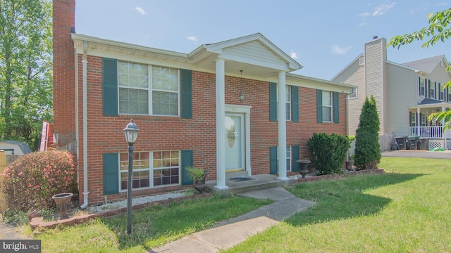 5941 Plumwood Ln, Woodbridge, VA 22193 - view of front of house with a front yard and brick siding