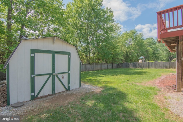 5941 Plumwood Ln, Woodbridge, VA 22193 - view of yard featuring a storage unit, an outbuilding, and a deck