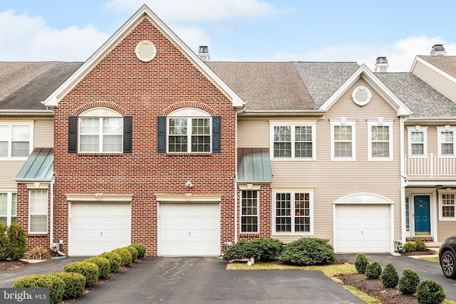 171 Timothy Cir, Wayne, PA 19087 - townhome / multi-family property featuring a chimney, brick siding, driveway, and roof with shingles