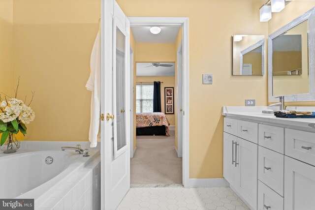 171 Timothy Cir, Wayne, PA 19087 - ensuite bathroom featuring tile patterned flooring, a ceiling fan, a garden tub, vanity, and baseboards