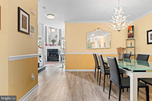 171 Timothy Cir, Wayne, PA 19087 - dining space featuring a chandelier, wood finished floors, ornamental molding, a fireplace, and baseboards