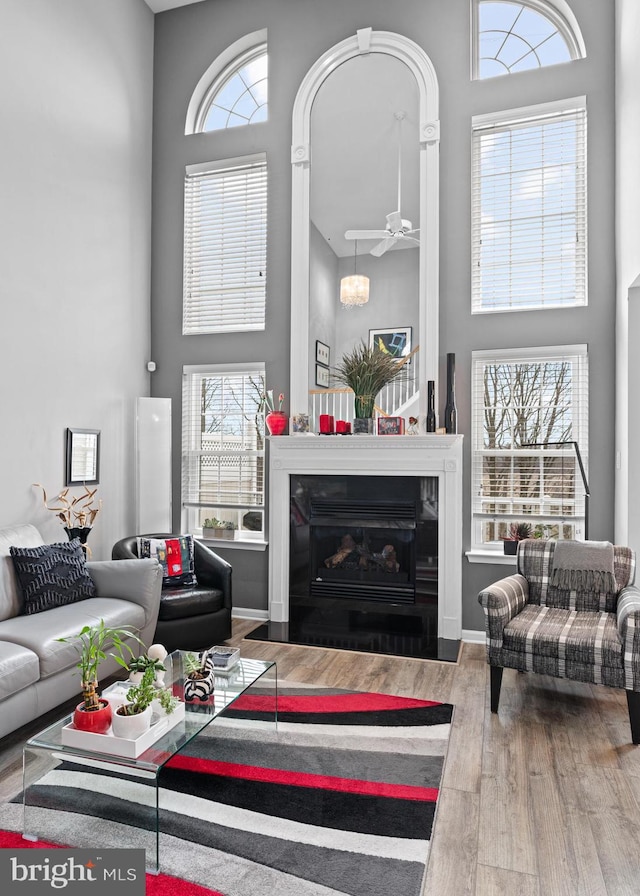 171 Timothy Cir, Wayne, PA 19087 - living area featuring a towering ceiling, wood finished floors, plenty of natural light, and a ceiling fan