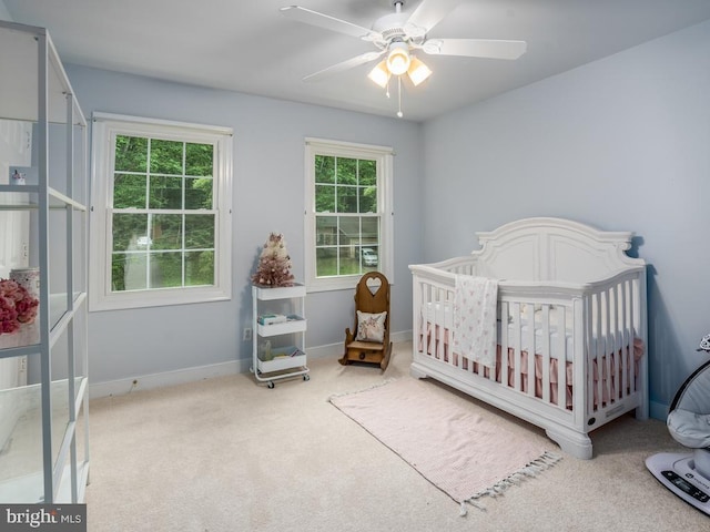 1004 England Dr, Stafford, VA 22554 - carpeted bedroom with a crib, baseboards, and ceiling fan