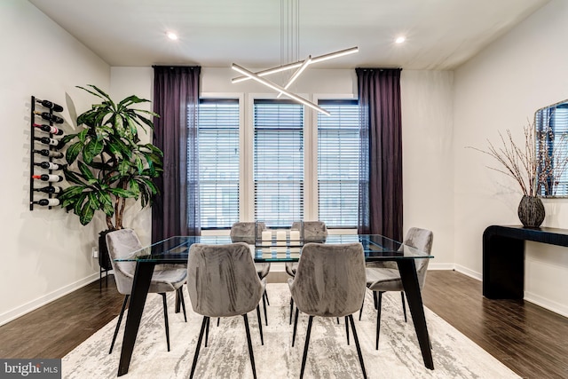 dining space with wood finished floors, baseboards, and recessed lighting