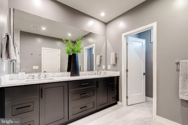 full bathroom with double vanity, baseboards, tile patterned floors, and recessed lighting