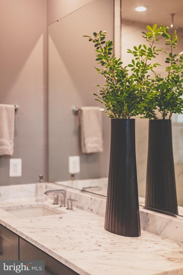 bathroom with vanity and recessed lighting