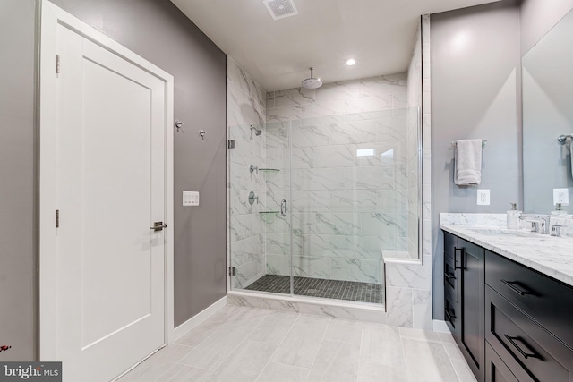 bathroom with a stall shower, baseboards, vanity, and recessed lighting