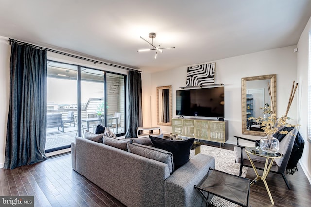 living area featuring dark wood finished floors and baseboards