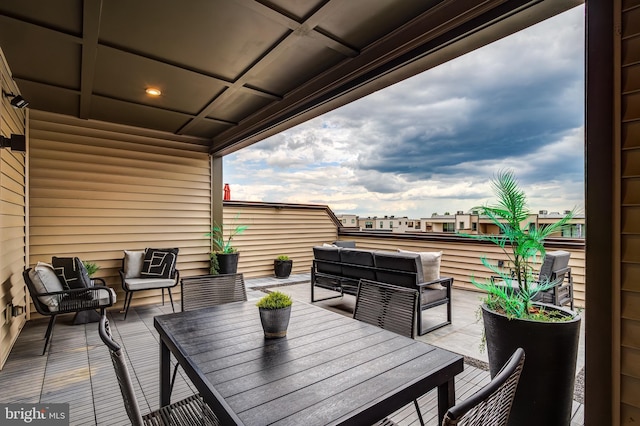 deck with an outdoor hangout area