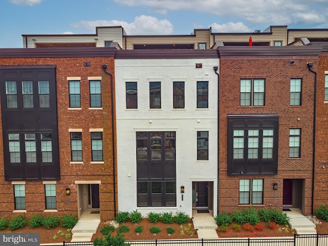 view of property featuring a fenced front yard