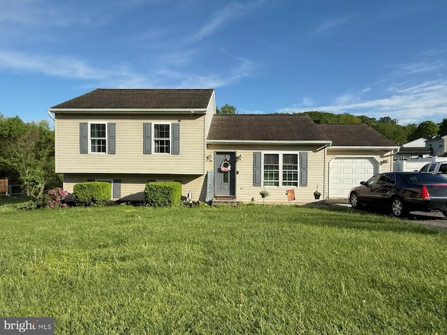 70 Rebecca Dr, York Haven, PA 17370 - tri-level home featuring a garage, a front yard, and a shingled roof