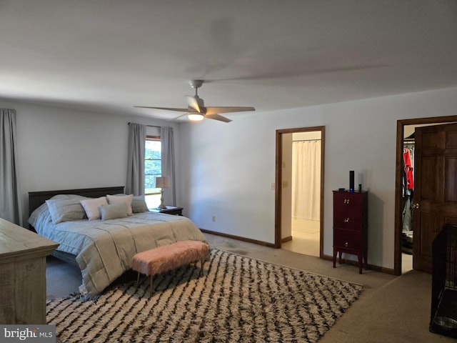 105 Woodview Dr, Harrington, DE 19952 - carpeted bedroom featuring a walk in closet, a closet, ceiling fan, and baseboards