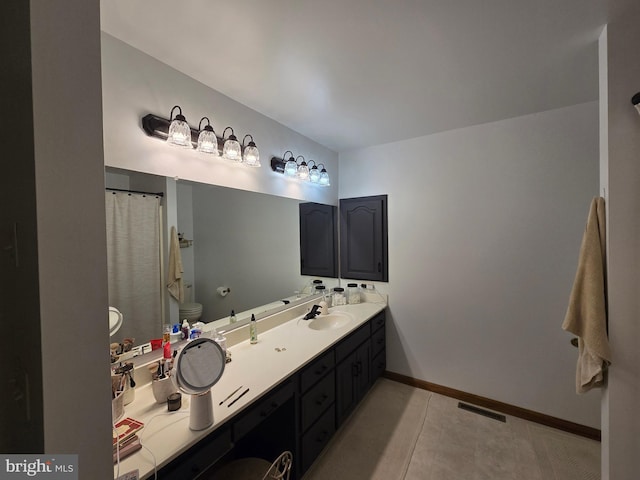 105 Woodview Dr, Harrington, DE 19952 - full bathroom featuring toilet, vanity, baseboards, and tile patterned flooring
