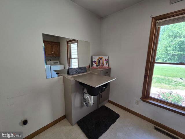 105 Woodview Dr, Harrington, DE 19952 - washroom featuring washer / dryer, cabinet space, and baseboards