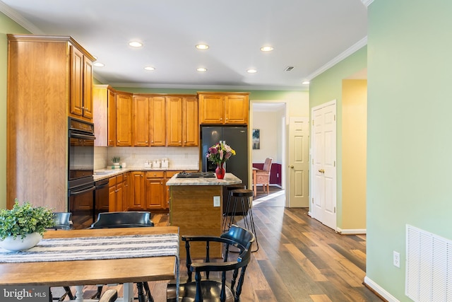 kitchen with recessed lighting, backsplash, crown molding, dark wood-style floors, and baseboards